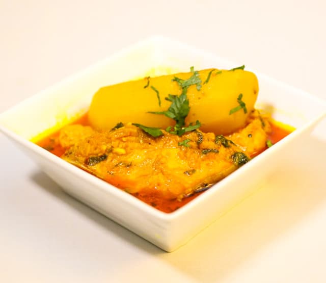 FISH CURRY (Mirgel) (On The Bone) (£7.95)